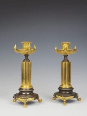 A Pair of French Empire Bronze and Ormolu Candleholders